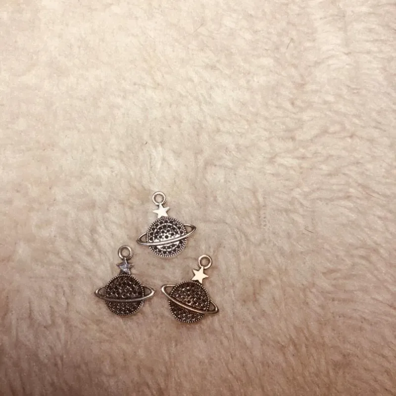 Dijes Saturnos de acero inoxidable 