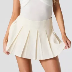 Saya plisada color crema
