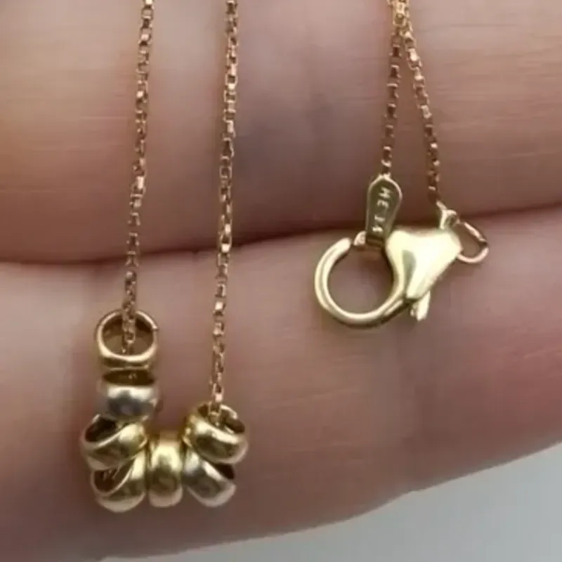 Cadena veneciana con bolas colgantes