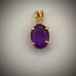 Dije Original 14k con circón morado