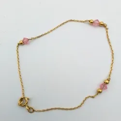 Guillo con gemas rosadas 18K