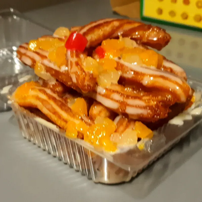 Churros cubiertos de leche condensada
