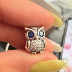 Charm búho de ojos azules