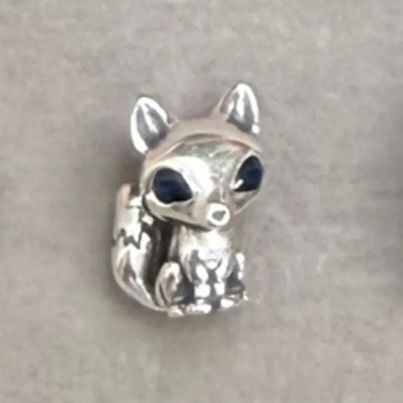 Charm zorro de ojos azules