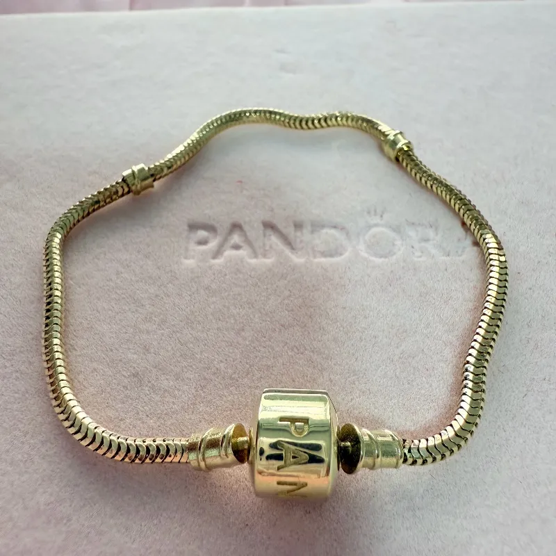 Pandora de oro 10 kilates cierre barril 