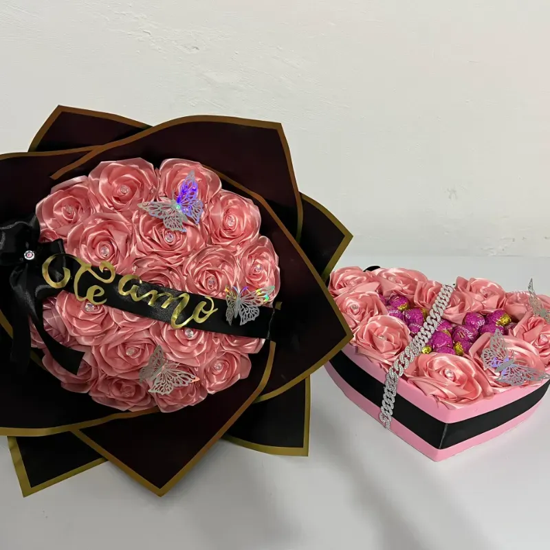 Juego de ramo con papel negro y corazón con bombones en rosado