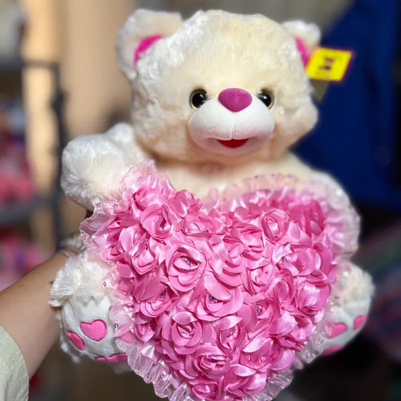 Oso peluche con corazón rosa 