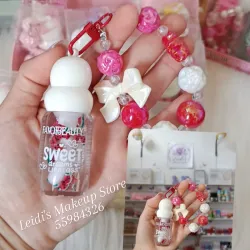 Lip gloss transparente con colgante