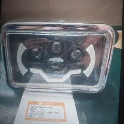 Faro delantero Ax 100 con lupa