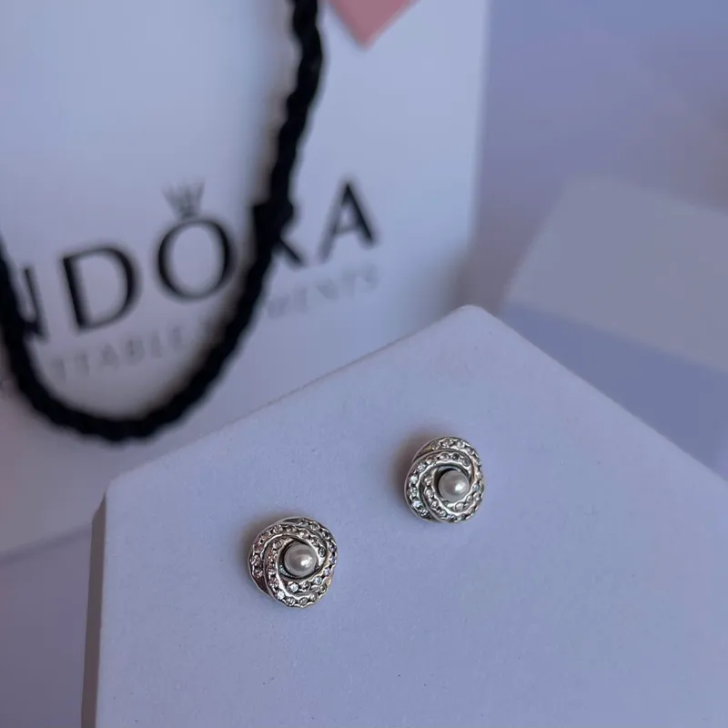 Aretes Pandora nudito perla