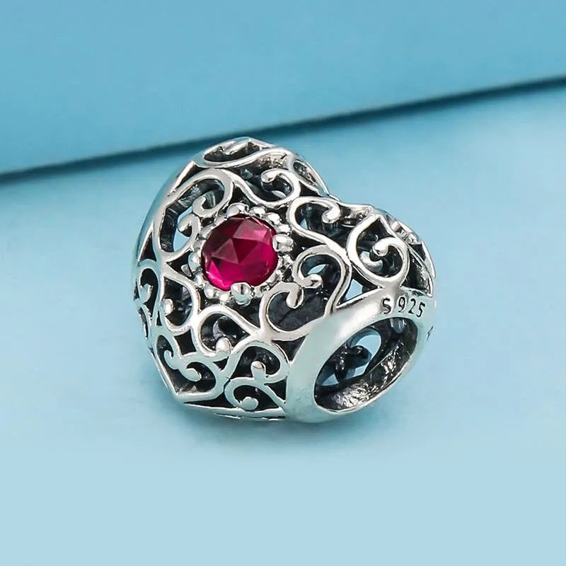 Charm corazón enredado rojo