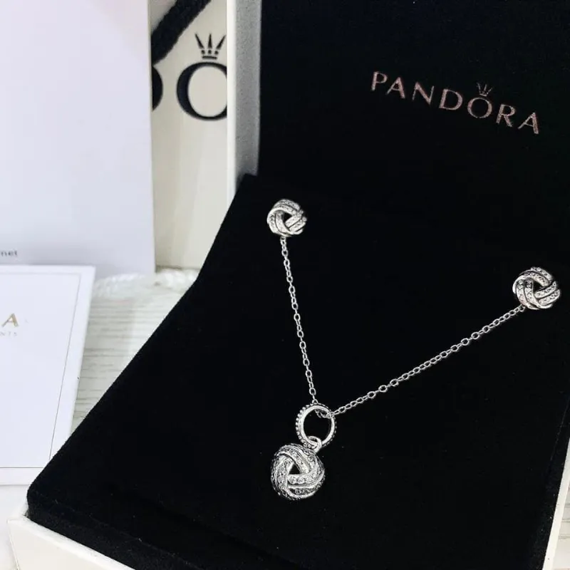 Conjunto aretes y collar Pandora nudo 
