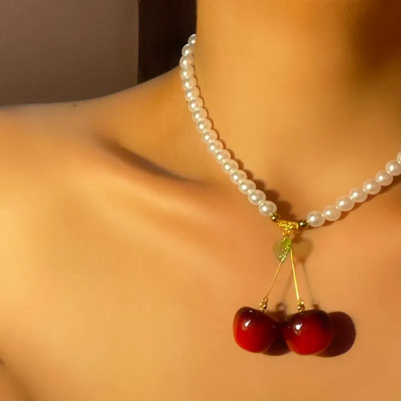 Cerezas con perla blanca redonda 