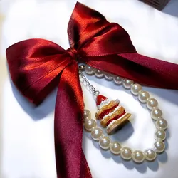 Colgante con lazo rojo y charm 