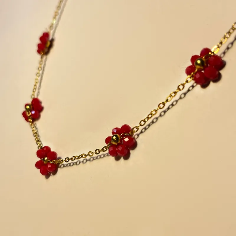 Tobillera de acero inoxidable con flor de vidrio 