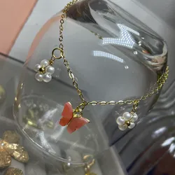 Tobillera de acero inoxidable con mariposa y flores perladas 