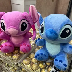 Peluches Stitch y Ángela 