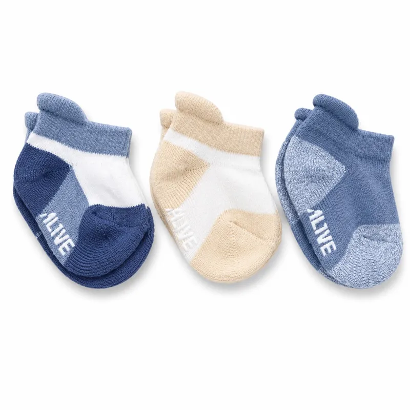 Set de tres pares de medias para bebé. Ambos sexos.