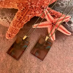 Cadena de acero con dije encapsulado