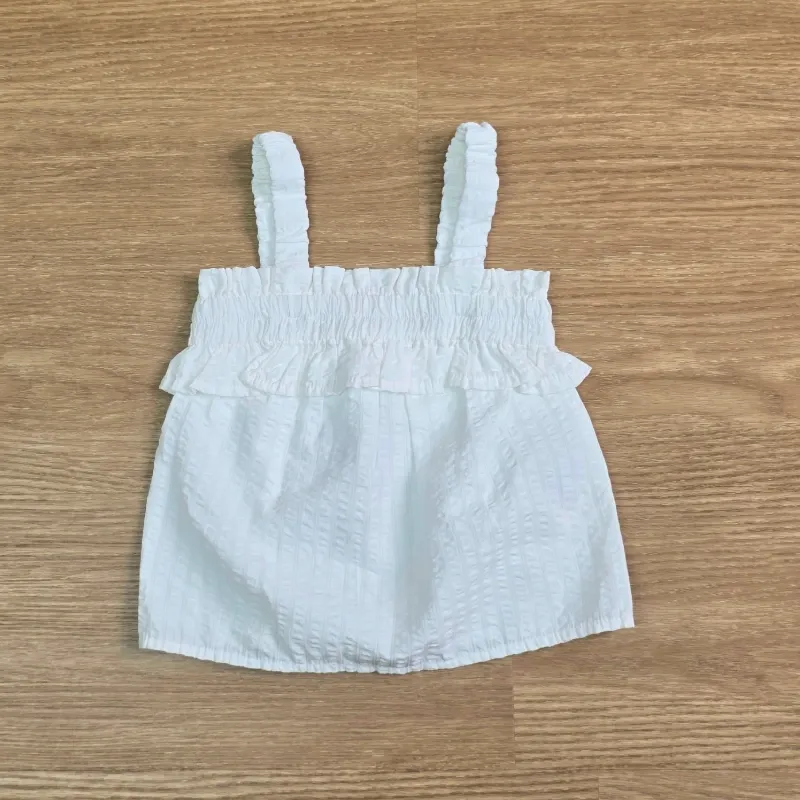 Blusa blanca con vuelo y elástico