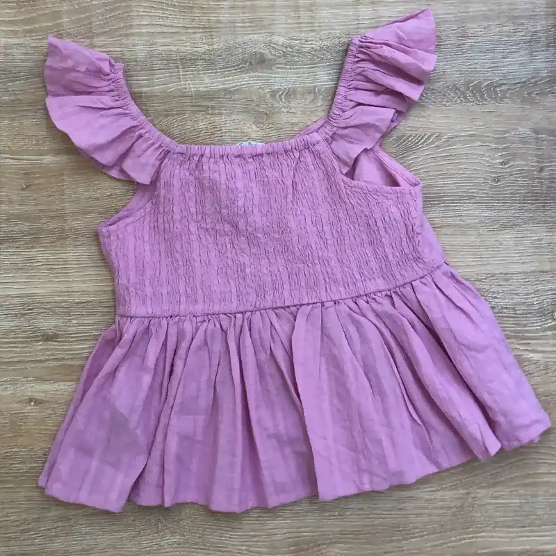 Blusa color rosado con vuelos 