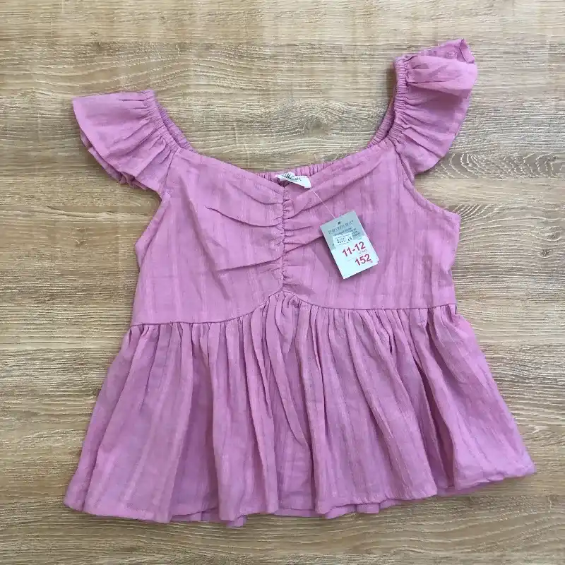 Blusa color rosado con vuelos 