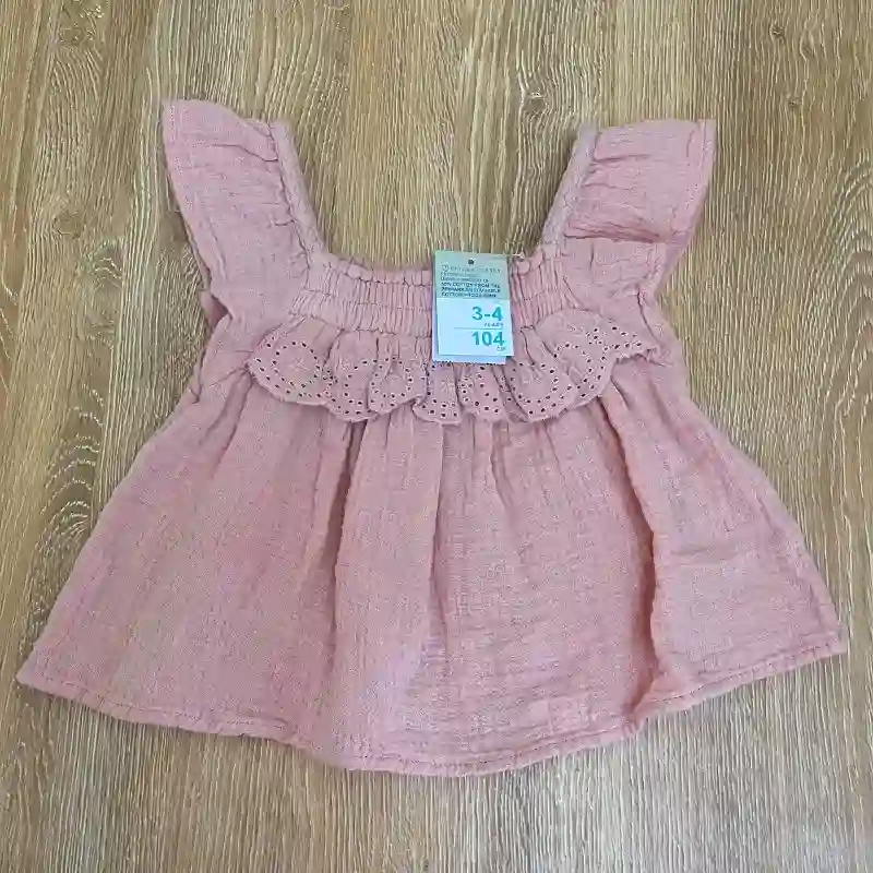 Blusa con vuelo color rosado