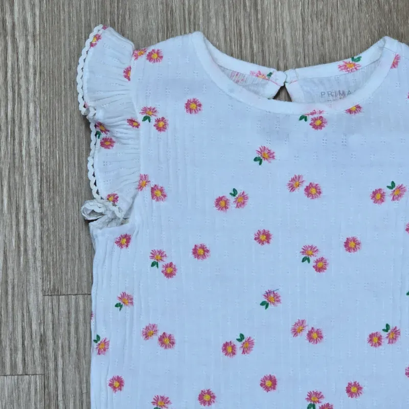 Blusa con Vuelos blanca con flores naranjas