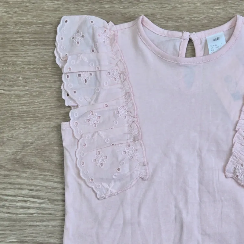 Blusa con vuelos color rosa