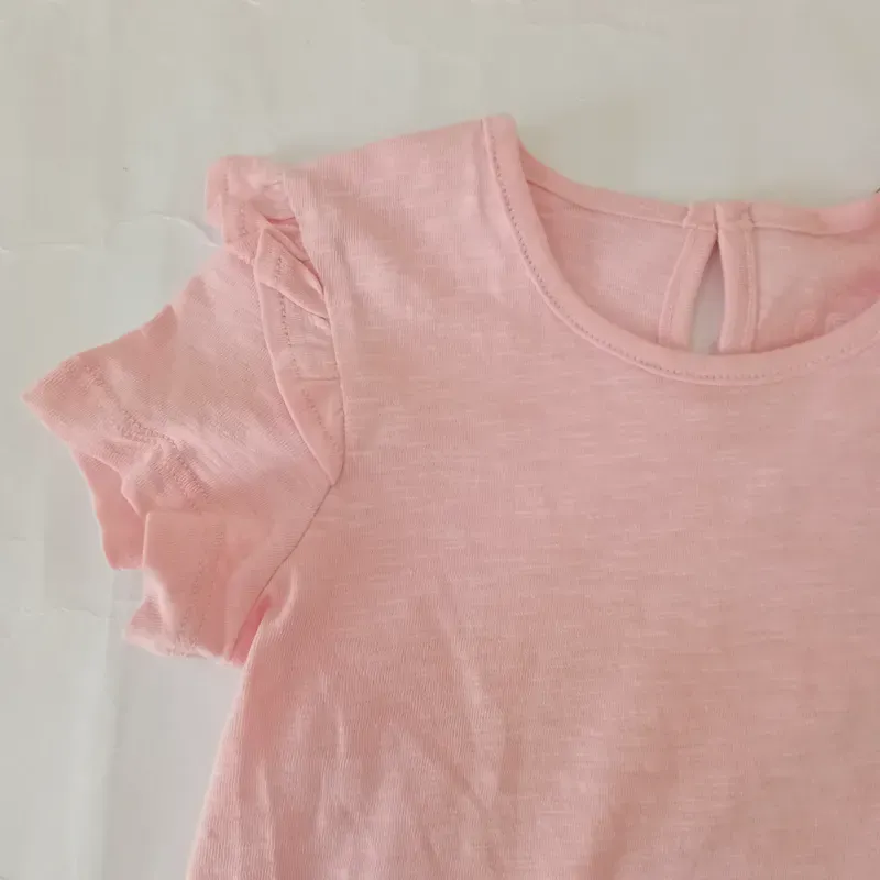 Blusa con vuelos color rosado