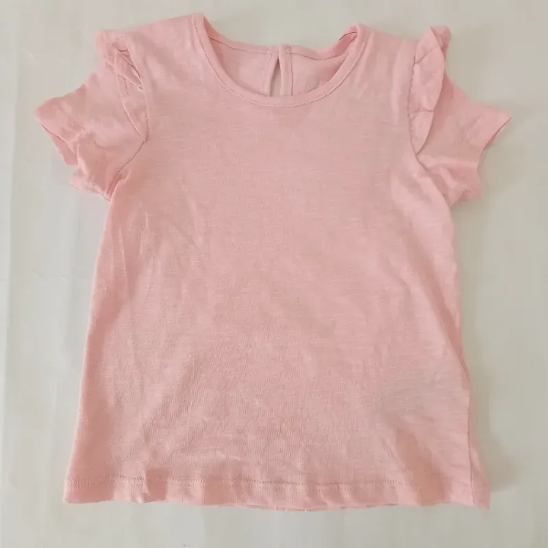 Blusa con vuelos color rosado