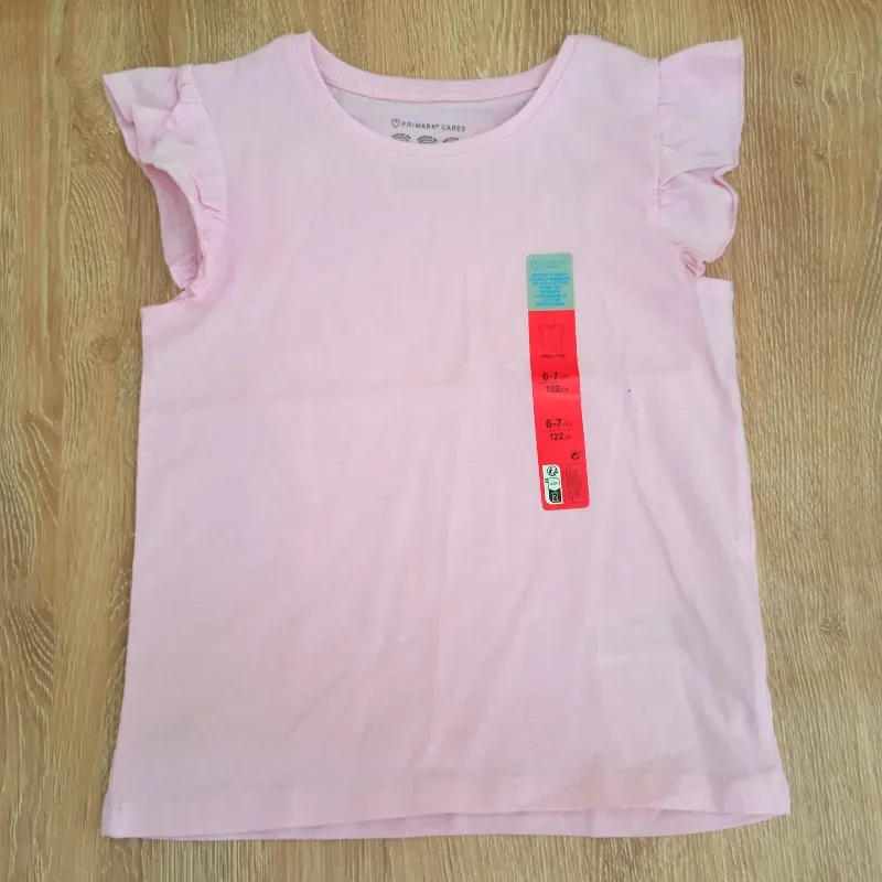 Blusa con vuelos en las mangas color rosado 