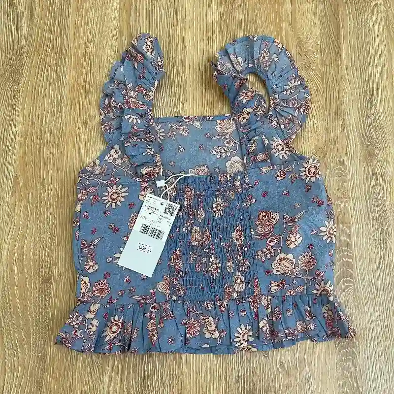 Blusa Mango con vuelos 
