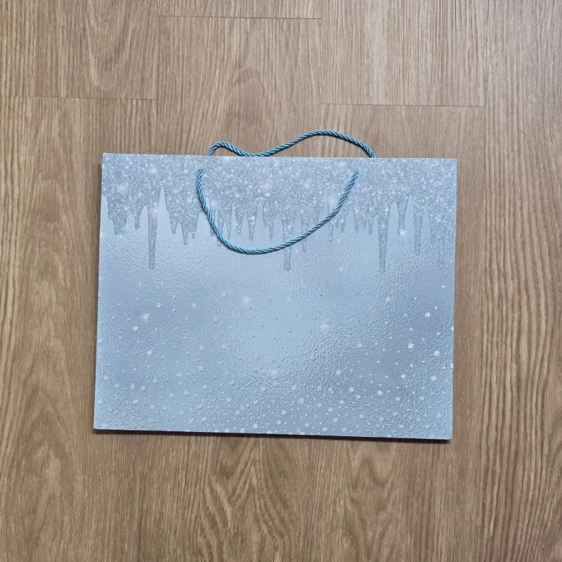 Bolsa de regalo color azul con brillos