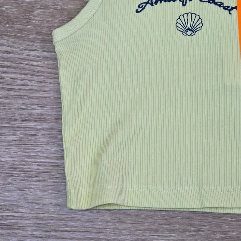 Camiseta de Canalé color amarillo con concha