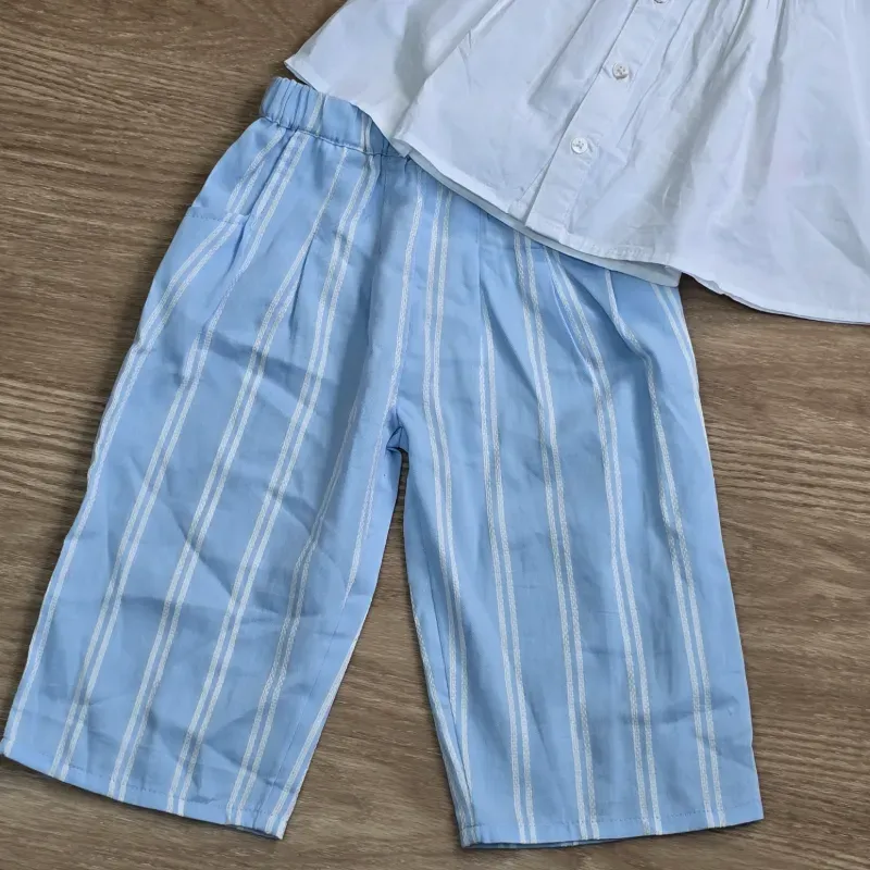 Conjunto de pantalon y blusa blanca