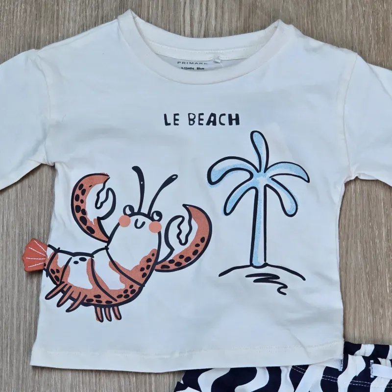 Conjunto de pulover de langosta y short de rayas con bolsillo