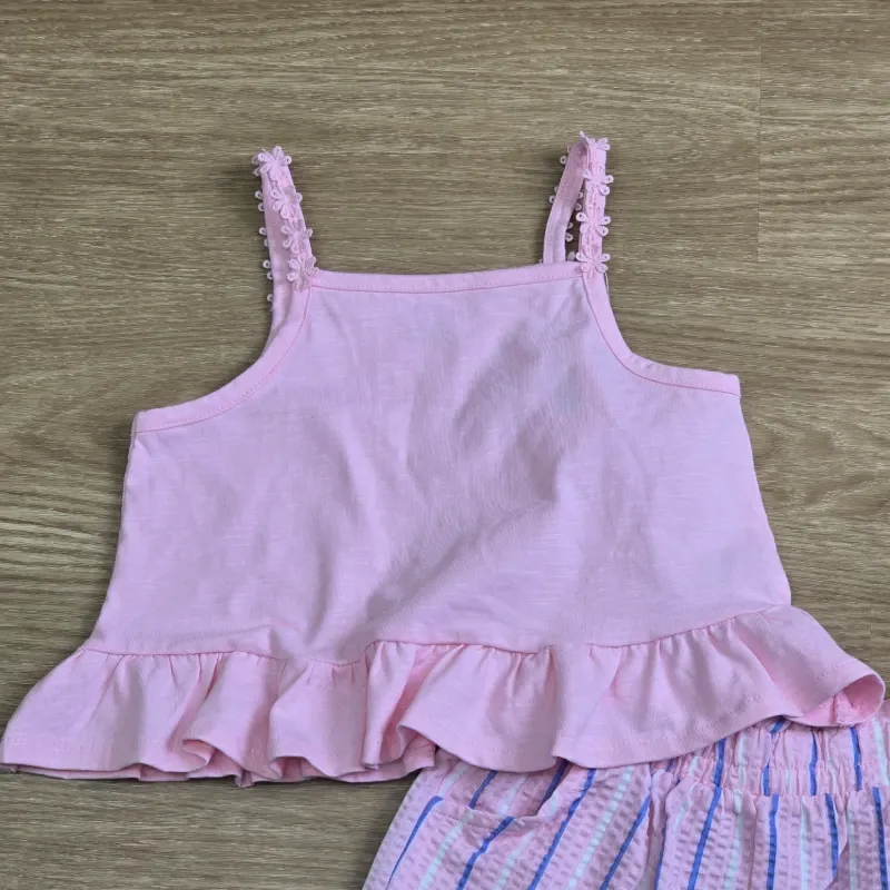 Conjunto rosa de blusa y short