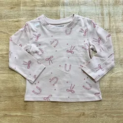 Enguatada rosada con lazos y herraduras 