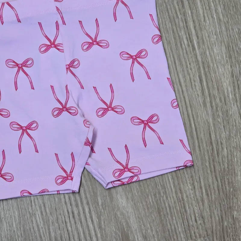 Leggin corta color rosa con lazos