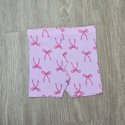 Leggin corta color rosa con lazos