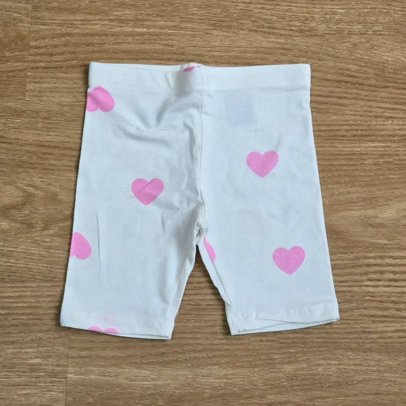 Leggin corto blanco de corazón.
