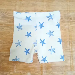 Leggins de color blanco con estrellas de mar azules