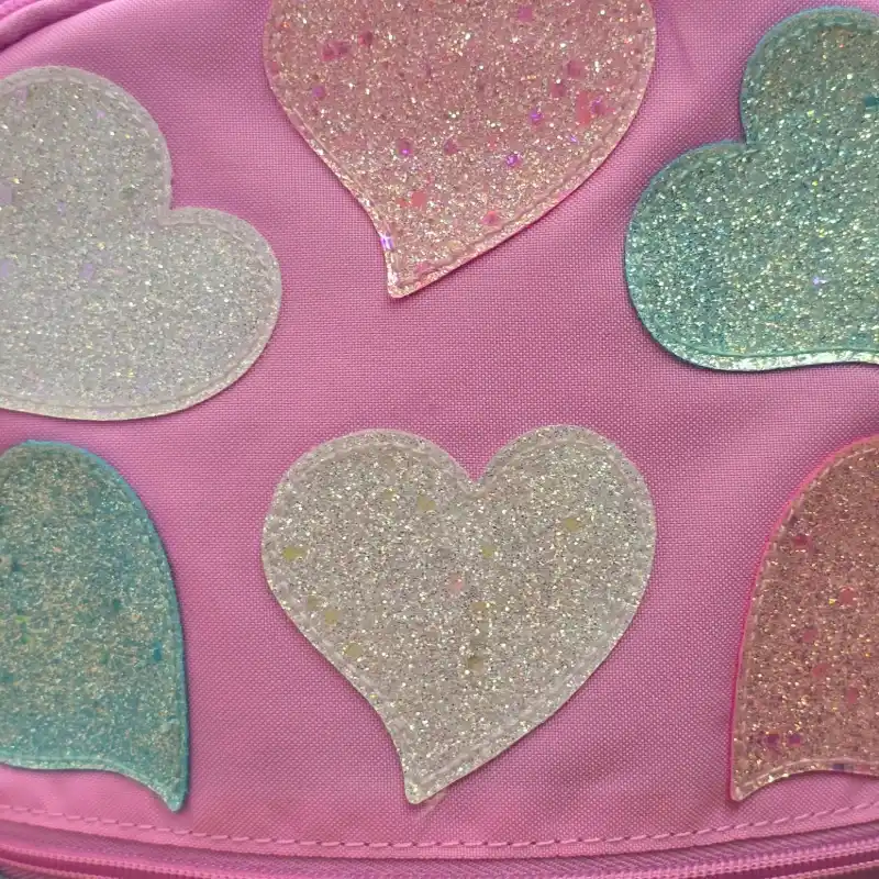 Mochila rosada tornasol corazones