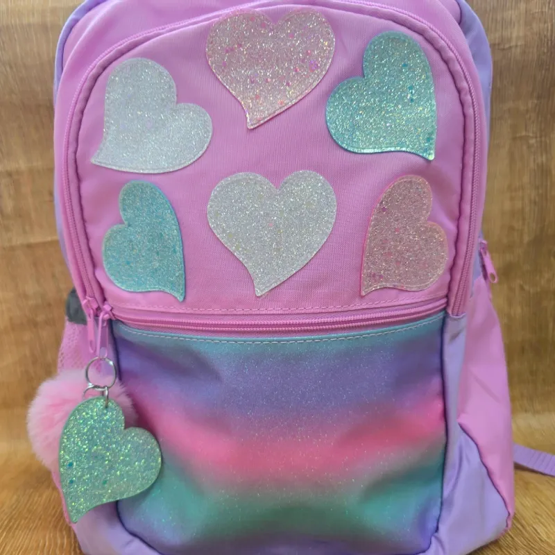 Mochila rosada tornasol corazones