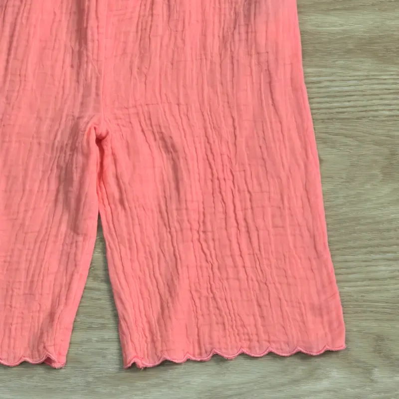 Mono Pantalon estilo Hilo con flores bordadas en color naranja
