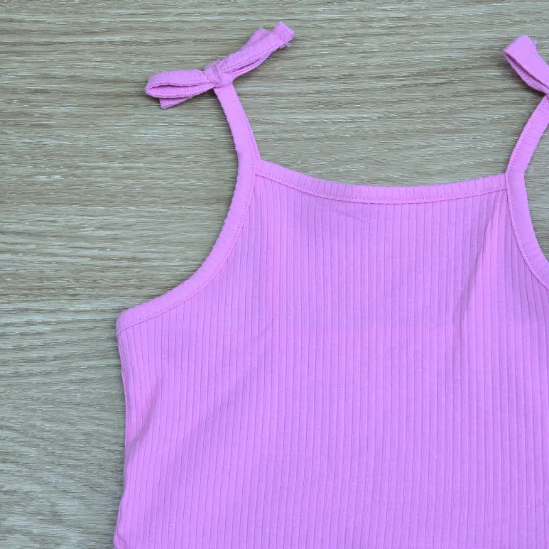 Mono short color rosado con lazos