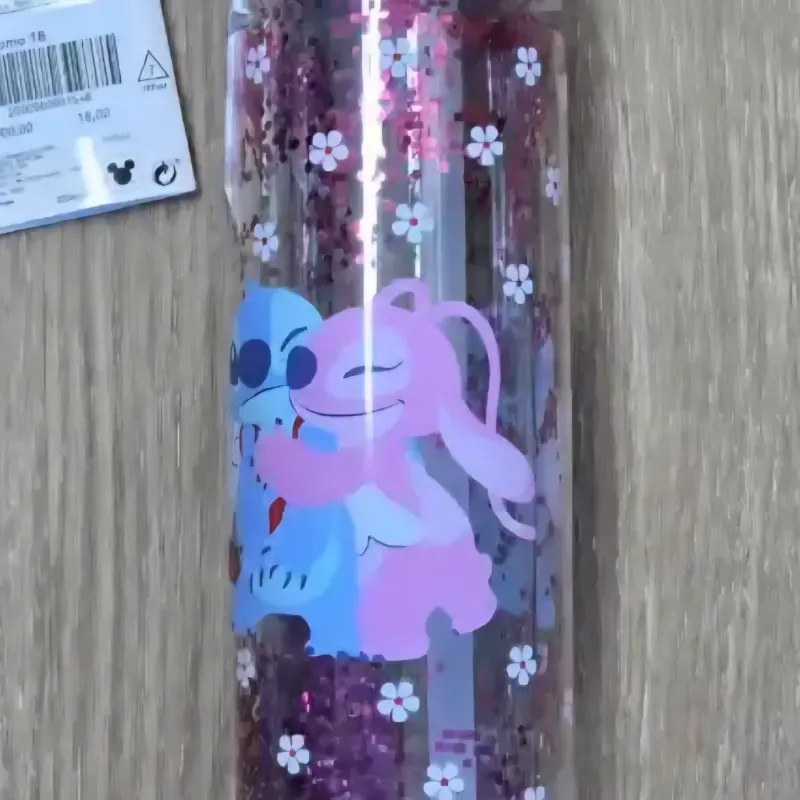 Pomo rosado de Stich y Angel con flores blancas