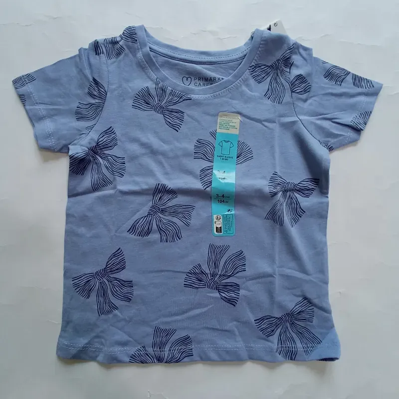 Pulóver azul con lazos 