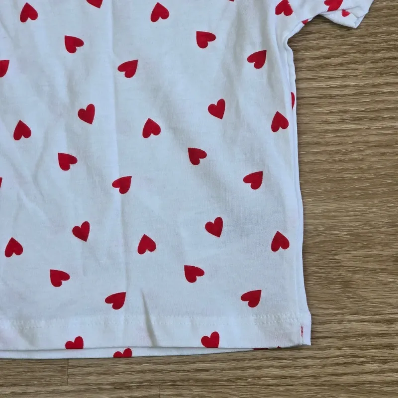 Pulover blanco con corazones